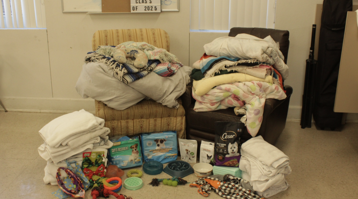 Valorie Houston sets up all of the donations collected in her room. Donations were collected from Nov. 11 through the 15.